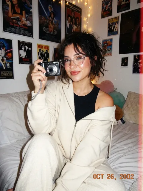 Y2K digital-camera bedroom portrait